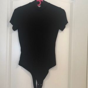 Black short sleeve turtleneck body suit